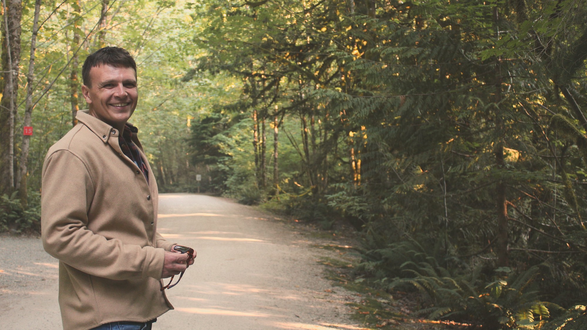 Kieran walking a forest road